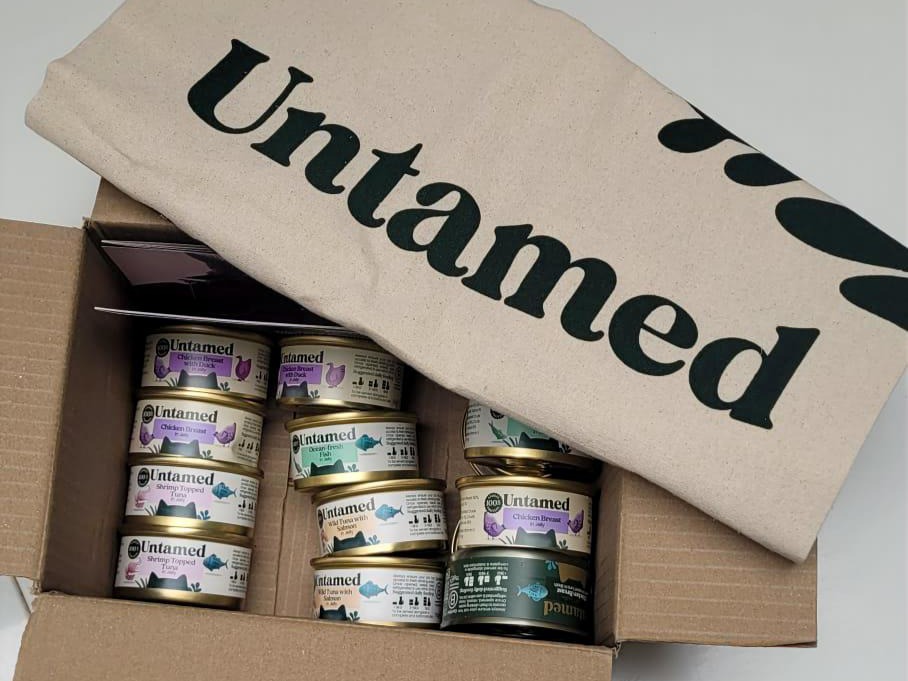 Box of Untamed cat food tins